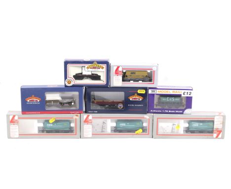 Eight OO gauge goods wagons. Including tankers, bulkers, flatbeds etc from Bachmann, Lima and Dapol.