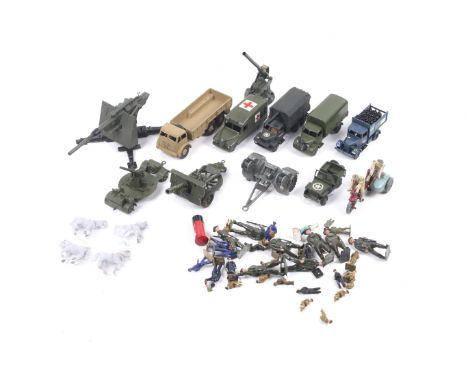 A collection of diecast metal military vehicles and model soldiers. Noting Dinky and Britains with trucks and field guns plus
