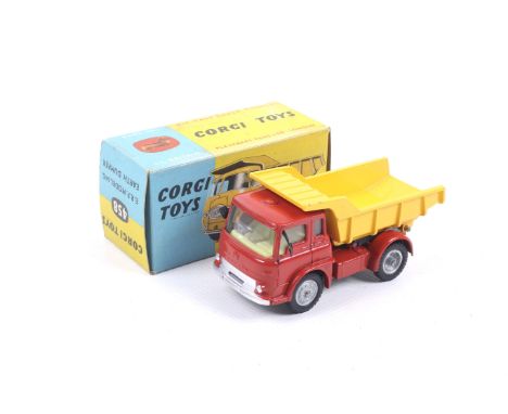 A Corgi diecast ERF Model 64G Earth Dumper. No. 458, with red body and yellow trailer bed, in original box.