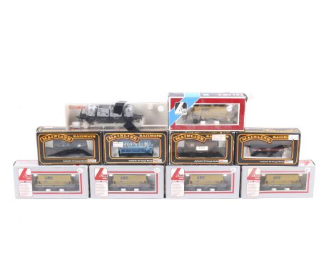 Ten OO gauge goods wagons. Including hoppers, tankers and flatbeds etc from Lima and Mainline.