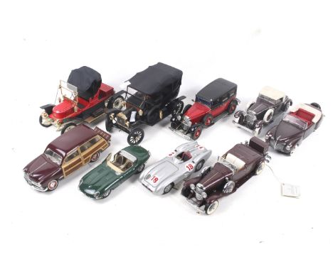 A collection of nine 1:24 scale Franklin Mint diecast cars. Including Mercedes Benz W196R, 1935 Mercedes Benz K Grosser, 1949