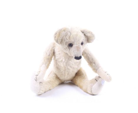 A vintage Chad Valley golden brown teddy bear. With a friendly face and adjustable limbs, H33cm