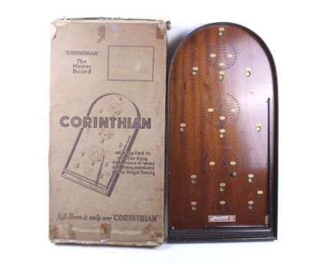 A 'Corinthian' Pinball game. A wooden board with metal nails, complete with balls, in original box, 75cm.