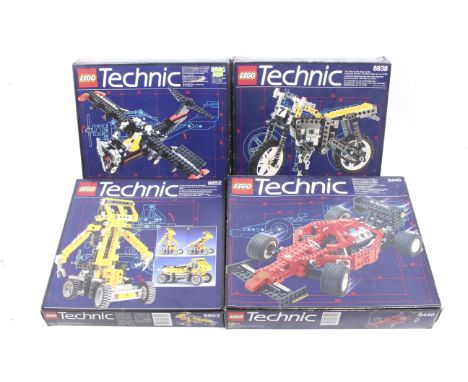 A collection of four Lego Technics sets. Comprising one racing car no. 8440, one transforming vehicle no. 8852, one aeroplane