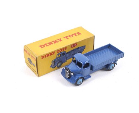 A Dinky diecast Austin Wagon. No. 412, dark blue body with light blue wheels, in original box.