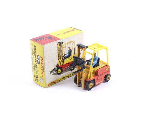 A Dinky diecast Conveyancer Fork Lift Truck. No. 404, yellow body with black pallet forks, complete with instruction booklet,