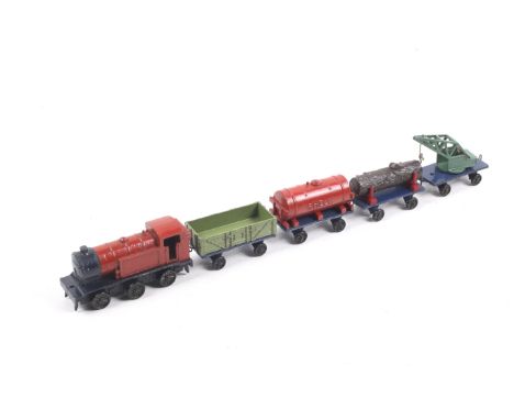 A Meccano Hornby Series tank engine and goods wagons. Comprising a red tank engine with four wagons including a bulker and a 
