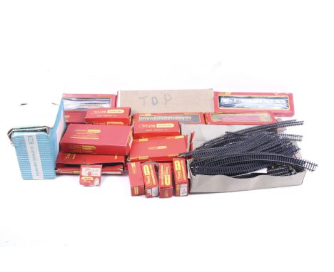 A collection of OO gauge railway locomotives and accessories. Including a GWR 0-6-0 tank engine plus a range of coaches and w