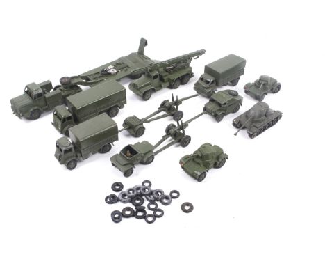 Twelve unboxed Dinky diecast military vehicles. Featuring a 10 ton army truck, armoured car, field artillery tractor, chara m