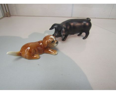 A Royal Dux porcelain Piglet in matt black together with Goebel Puppy