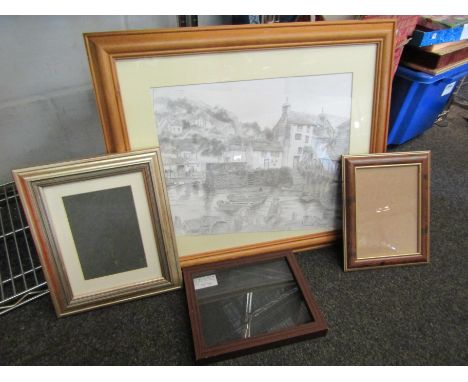 A black and white print depicting a harbour scene with fisherman and their boats, and a quantity of photograph frames