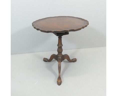 A 19th century style tilt-top occasional table, with pie crust edge, bird-cage movement and tripod base. 61x64cm.Splits to to