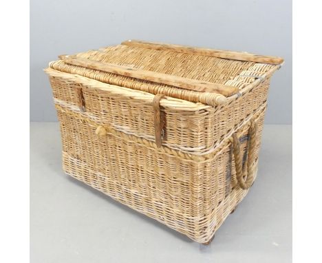 A wicker laundry hamper. 95x64x64cm. 