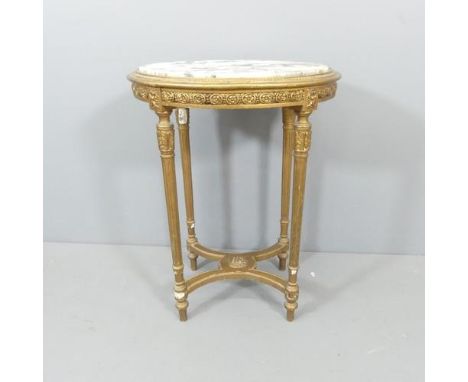 A French oval marble-topped occasional table, on gilt painted base, with carved and fluted decoration and X-shaped stretcher.