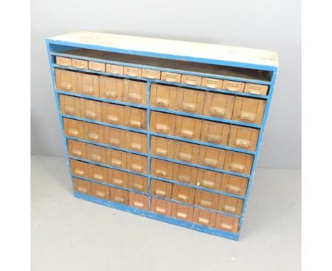 A vintage painted pine bank of 59 tool drawers. Overall 117.5x110x31.5cm. 