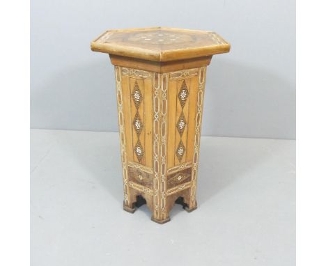 A late 19th century Syrian hexagonal side table with ebony, specimen wood marquetry and bone inlaid decoration. 44x63x38cm.