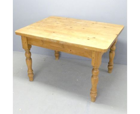 A rectangular pine farmhouse kitchen table. 122x78x92cm.Some small repairs to top. No drawer. 