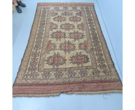 A large cream or light brown ground Sumak Kilim carpet, 278x170cm. 