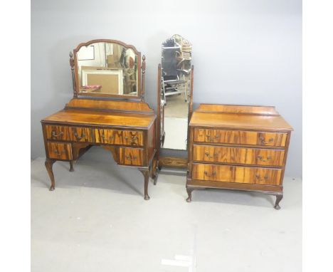 A 1930s bedroom suite comprising a crossbanded mahogany chest of three long drawers with raised back and cabriole legs, a mat