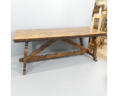 A Spanish olivewood plank topped dining table on oak base, with carved decoration. 201x78x84cm.This table comes to pieces for