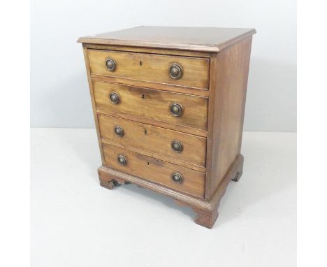 A 19th century small mahogany chest of four drawers, raised on bracket feet. 59x71x43cm. 