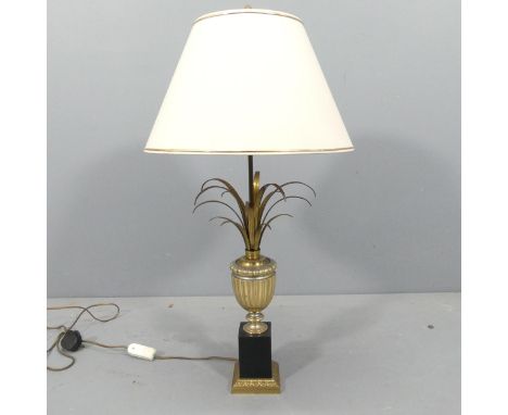 A mid-century Hollywood Regency style heavy brass pineapple design lamp on stepped metal base, in the manner of Maison Charle