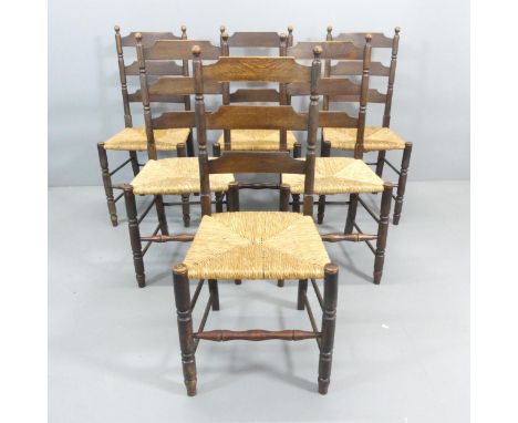 A set of six French Country rush-seated ladder-back dining chairs. 