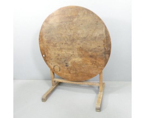 A late 19th century French cherry wood circular tilt-top wine tasting table. 98x74cm. 