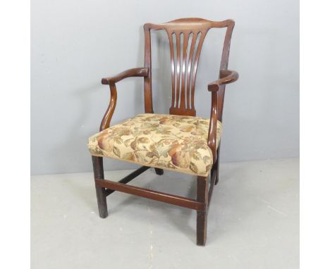 A mahogany and upholstered Chippendale style open armchair. 