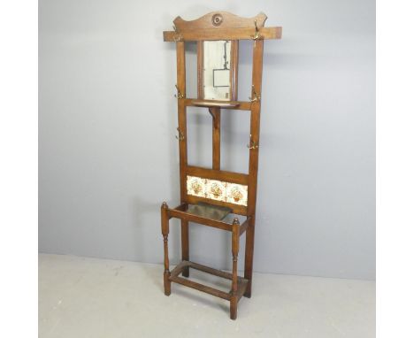 An oak Arts & Crafts style hall stand. 78x189x28cm.Structurally good condition. Tile panels are newly fitted. Missing drip tr