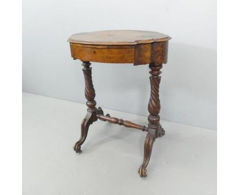 A Victorian walnut sewing table, with single frieze drawer and spiral turned supports. 61x76x48cm.Splits and bubbling to the 