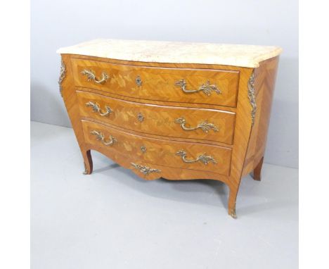 A French Louis XV style walnut veneered and satinwood strung bombe commode chest of three drawers, with marble top, brass mou