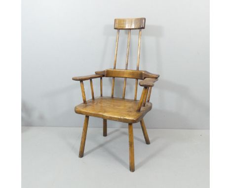 A primitive Welsh comb back style Windsor chair. Overall 72x123x60cm, seat 48x49x40cm.Left arm slightly loose in the joints. 