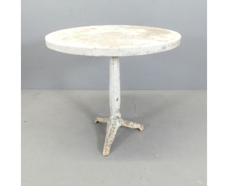 An oval reconstituted stone-topped garden table on painted metal base. 72x69x59cm. 