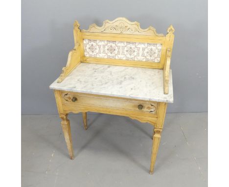 A Victorian pine and marble-topped wash stand, with raised tile back and single drawer. 77x108x44cm. 