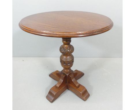 An oak circular-topped occasional table. 56x60cm. 