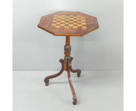 A 19th century mahogany octagonal games top table, on tripod base, width 44.5cm, height 73cm. 