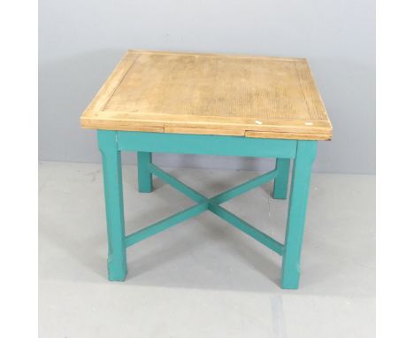 An early 20th century oak draw-leaf table on painted base. 87x74cm, extending to 146cm. 
