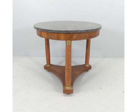 A French mahogany marble-topped Gueridon / centre table, raised on three turned legs with platform base. 70x67cm.Good used co