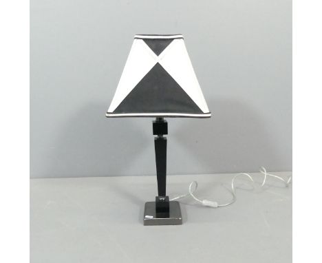 A contemporary table lamp, with resin column and chromed base. Height overall 58cm. 