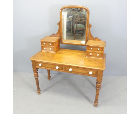 A Victorian mahogany and ebony strung dressing table, with raised mirrored back, six drawers and raised on tapered legs. 107x