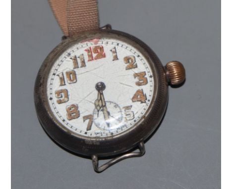 A gentleman's early 20th century white metal cased manual wind wrist watch, with Arabic dial and subsidiary seconds, on later