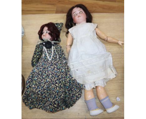 Two Schonau Wolfmeister bisque head dolls, one 20", one 16"