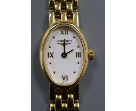 A lady's 750 yellow metal Longines manual wind wrist watch, on Longines 750 strap, with Longines box.
