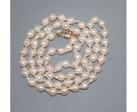 A modern single strand cultured baroque pearl necklace, with 9ct gold and diamond chip set clasp, 65cm