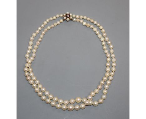 A double strand cultured pearl choker necklace with 9ct gem set clasp, 35cm.