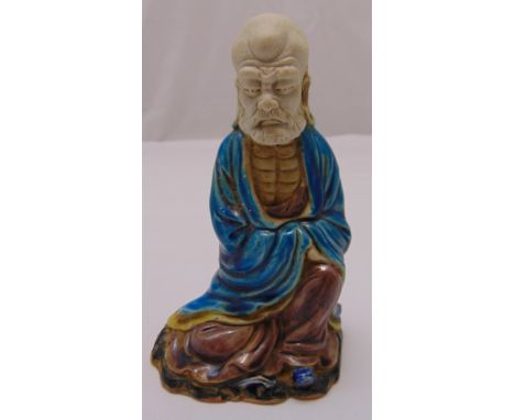 A Chinese polychromatic ceramic figurine of Lohan, 18cm (h)