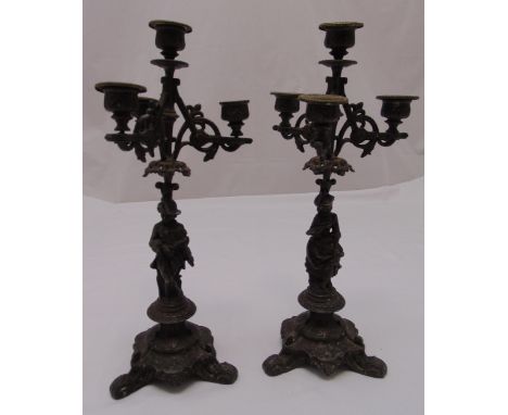 A pair of 19th century bronzed four light candelabra, the figural stems on raised triform bases, 40cm (h)