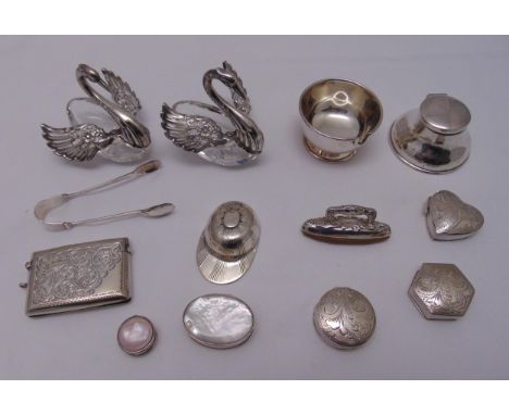 A quantity of hallmarked silver to include a vesta case, pill boxes of various shapes, a travel inkwell, bonbon dishes, a pai