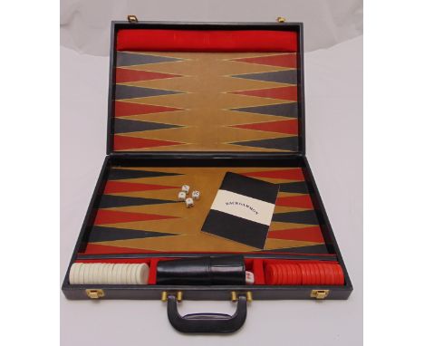 A cased backgammon set to include counters and dice